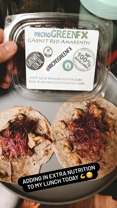 Customer Alicia with her microgreens from the farmers market